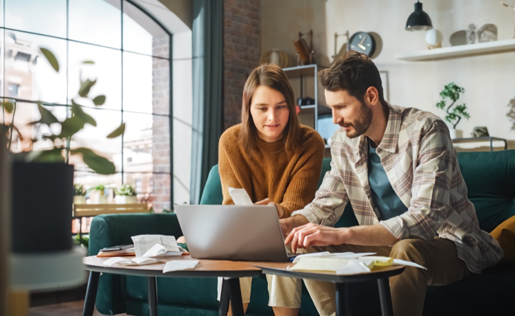 Man and woman at laptop video calling